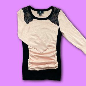 pink and black “IZ Byer” form-fitting sweater